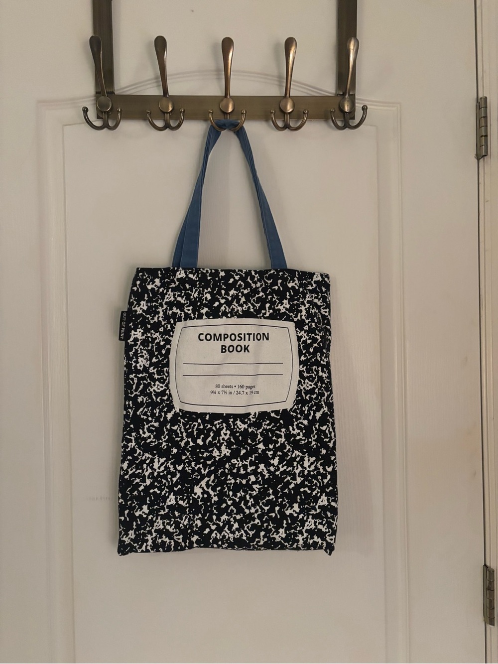 Out of Print Composition Book Print Tote Bag - Black & White with Blue Handles